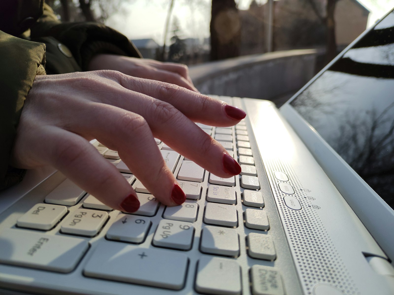 Intelligent Word Generator: Smarter Words, Instantly 4 Close up of hands typing on a laptop keyboard using a word generator tool